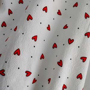 white heart printed shirt