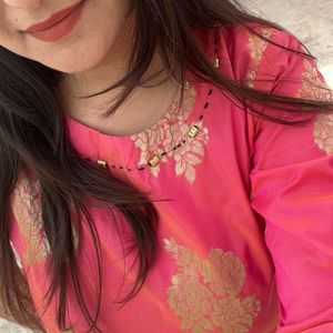 A Bright Pink Kurta With Neck Design