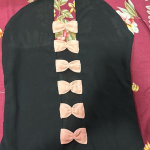 Black Top With Pink Bow In Back Side Of To