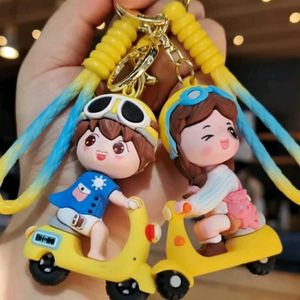 YELLOW SCOOTY GIRL KEYCHAIN