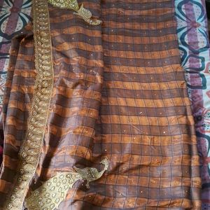 Attractive Checkered Brown Lace Border Saree