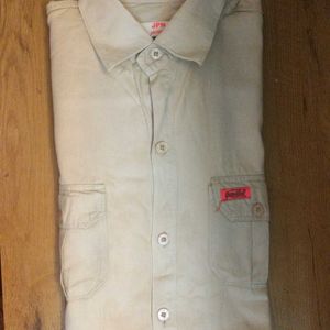 A Professional Shirt With Plain Tan Color