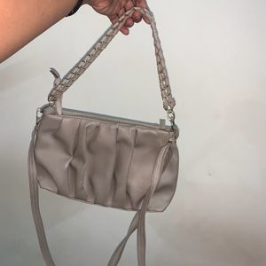 Beige Cremish Sling Bag.