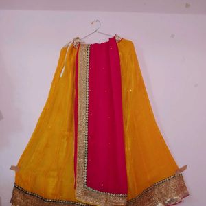 Rich Gold border Yellow lehenga with Pink dupatta