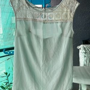 Mint green T-shirt with embroidery details