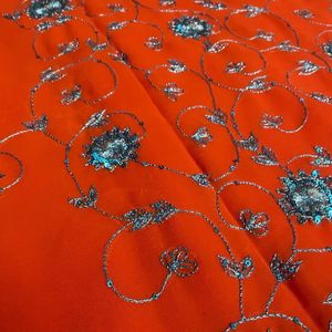 Orange Saree With Blue Shiny Embroidery