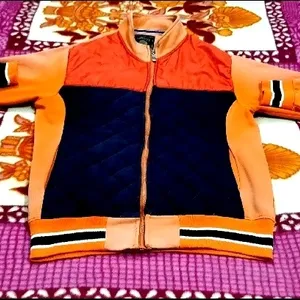 IT IS AN ORANGE COLOR JACKET....