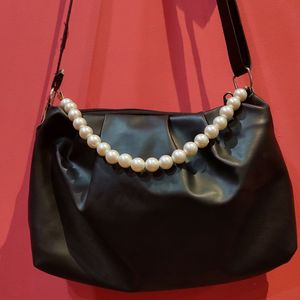 Black Sling Back With Pearl Strap Attachment