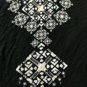 A Printed Black Strechable Top For Regular Wear