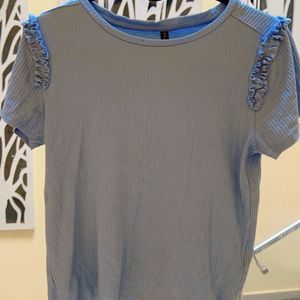 A Blue Shoulder Designed Top