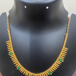 One Gram Gold Plated Jwellary Necklace.Green Stone Work .colour Guarantee .Hand Made Jwellary.Very Reasonable Price.18 Inches