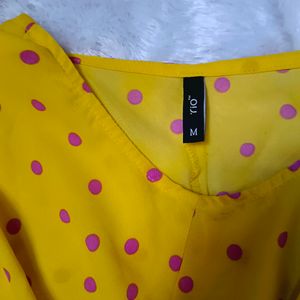 "Sunny Chic: Yellow Polka Dot Top with Tie-Up Bow"