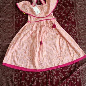 Baby Pink Frock With Gold Prints In It