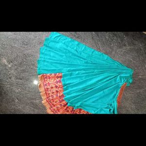 A Beautiful Sky Blue Saree With Red Flower Border