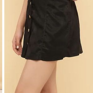 A line buttoned black skirt