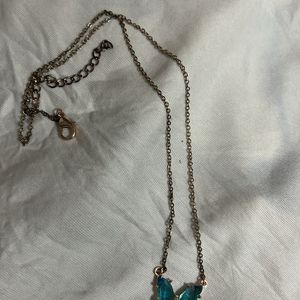 Blue Butterfly Pendant Along With Chain Attached