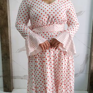 Three tiered orange polka print white dress