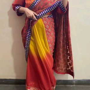 YELLOW ORANGE SHIFFON AND HEAVY EMBROIDERY SAREE