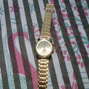 Titan Watch Good Condition golden Colour