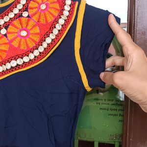 Flared Women Kurti With Rajasthani Work .