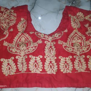 red blouse with golden stone work.