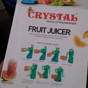 Manual Fruit Juicer With A Glass Tubler