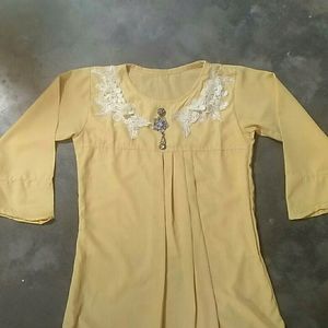 A Light Faded Yellow Pretty Top