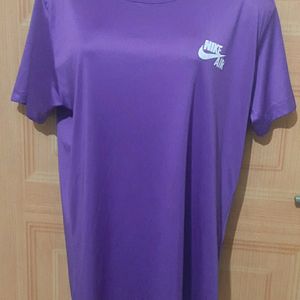 NIKE AIR PURPLE ACTIVE WEAR TSHIRT.