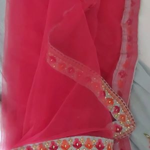 A beautiful grey lehenga with pink detailing