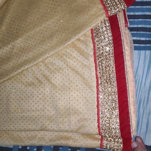 pretty red golden saree.