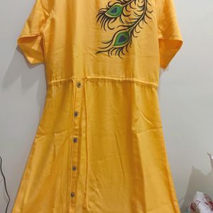 Yellow Morpankh Print Kurti With Tie Knots At Wais