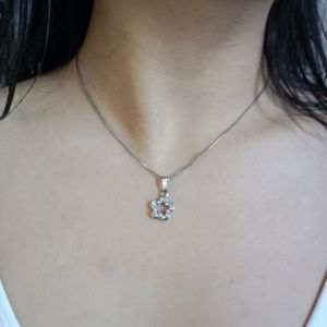 minimalistic flower neckpiece