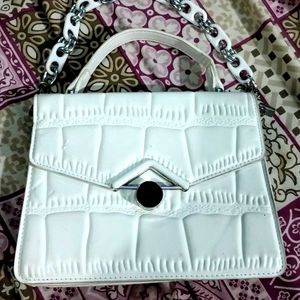 white hand purse