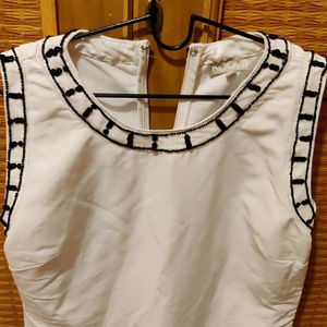 Koovs White sleeveless Top/Tunic by Udita