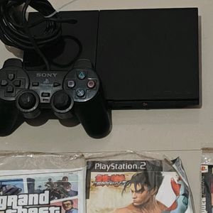 PS2 Console With 11 CD's (Non Working)