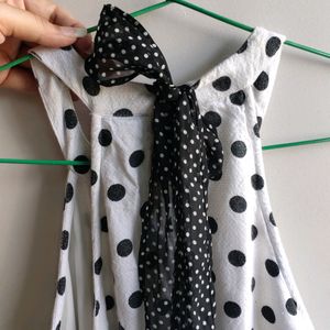 white and black polka dot mini dress