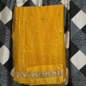 Yellow Net Saree With Blouse.