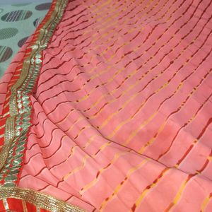 A Peach Colour Saree With Beutiful Red Strips