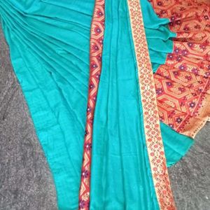 A Beautiful Sky Blue Saree With Red Flower Border