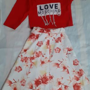 Red top with shoulder design and floral skirt