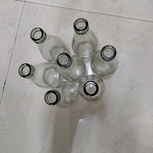 7 Same Empty Bottles