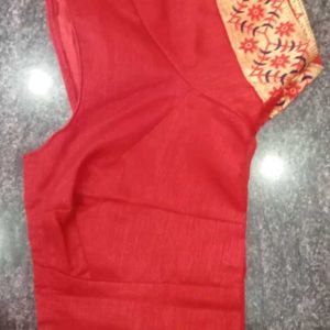 A Beautiful Sky Blue Saree With Red Flower Border