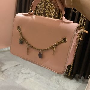 Baby pink sling bag.