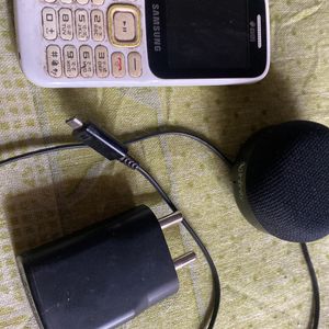 Phone , Charger And Speaker