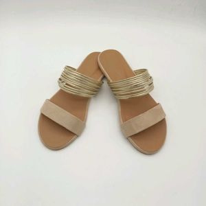 Tan And Gold Flat Sandals.