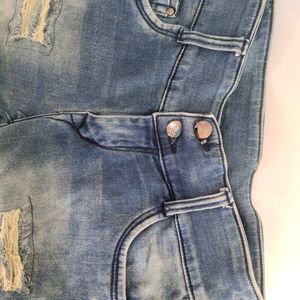 Women Ripped Faded Blue Jeans