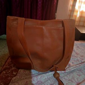 Tan Handbag with 2 big and 2 side pockets and 1 internal pocket