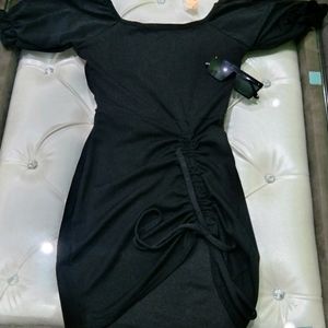 A mini black bodycon dress