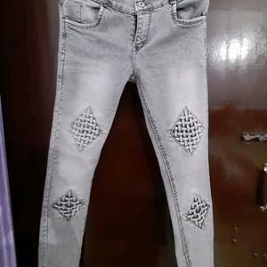 women grey mid rise jeans with beautiful check det