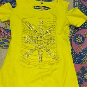 A Yellow Color Shoulder Cut Top.